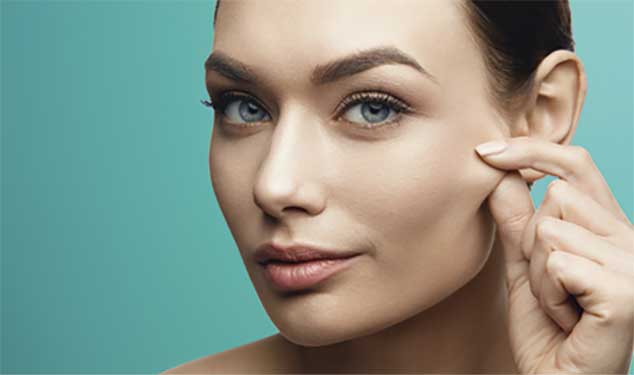 Woman pinching the skin on her cheek for Endolift laser skin lifting in London